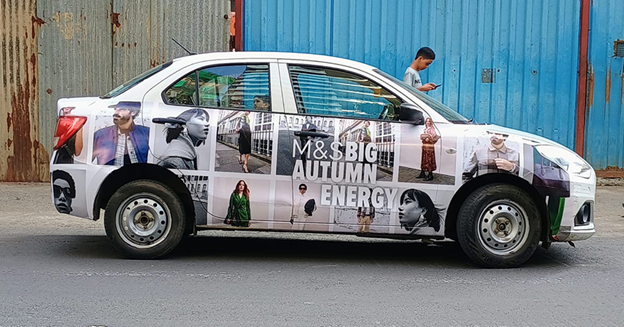 Branded cab wrap campaign in Delhi NCR showcasing lifestyle advertising