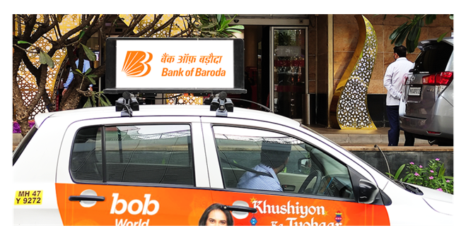 Rooftop cab advertising in Delhi showcasing brand visibility in traffic zones