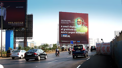 Large-format billboard on Western Express Highway Mumbai targeting high-speed vehicular traffic.