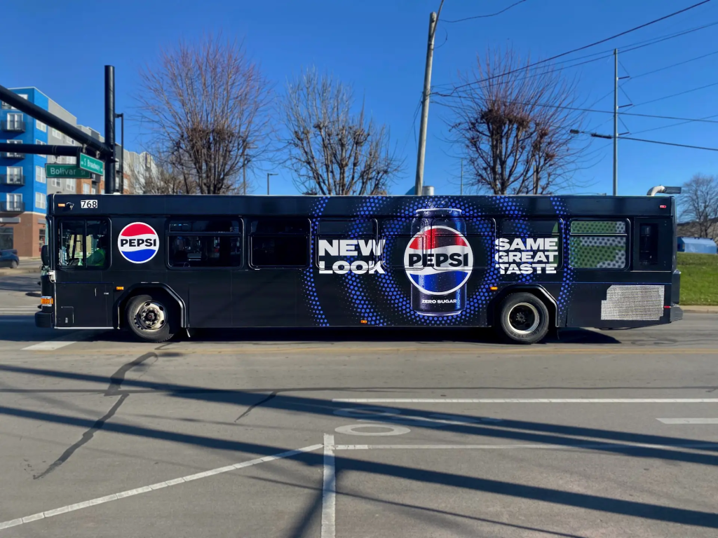 City bus fully wrapped with Pepsi Zero Sugar branding reading “New Look, Same Great Taste.”