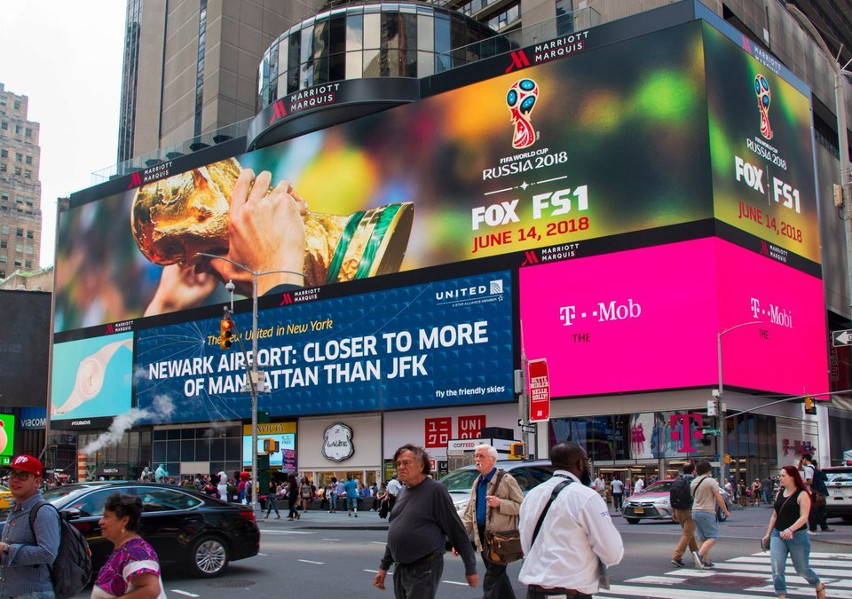 Massive Times Square digital billboard displaying Shopify Black Friday campaign with real-time sales data.