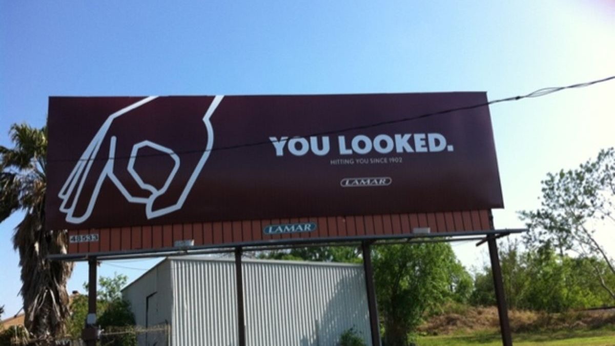 You Looked Billboard – Attention-Based Outdoor Advertising Minimalist billboard reading “You Looked” demonstrating attention-grabbing outdoor advertising