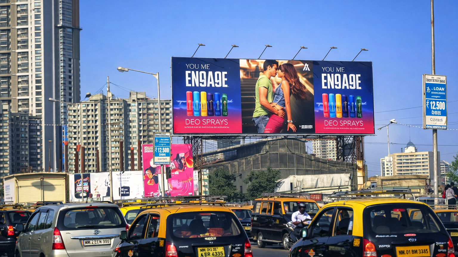 Engage deodorant billboard installed above a traffic-heavy urban road lined with taxis and high-rise buildings.