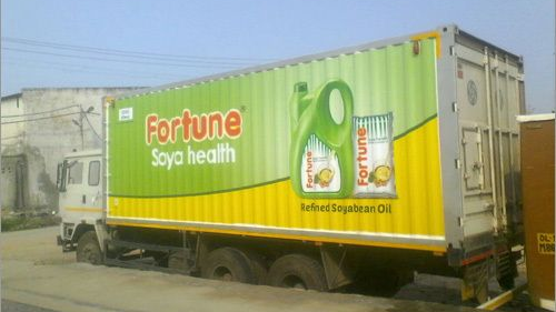 Delivery truck fully branded with Fortune soya health oil advertisement highlighting refined soybean oil product