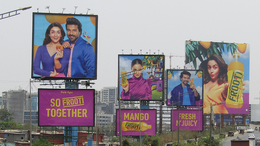 Multiple Frooti mango drink billboards on highway showcasing large scale outdoor advertising