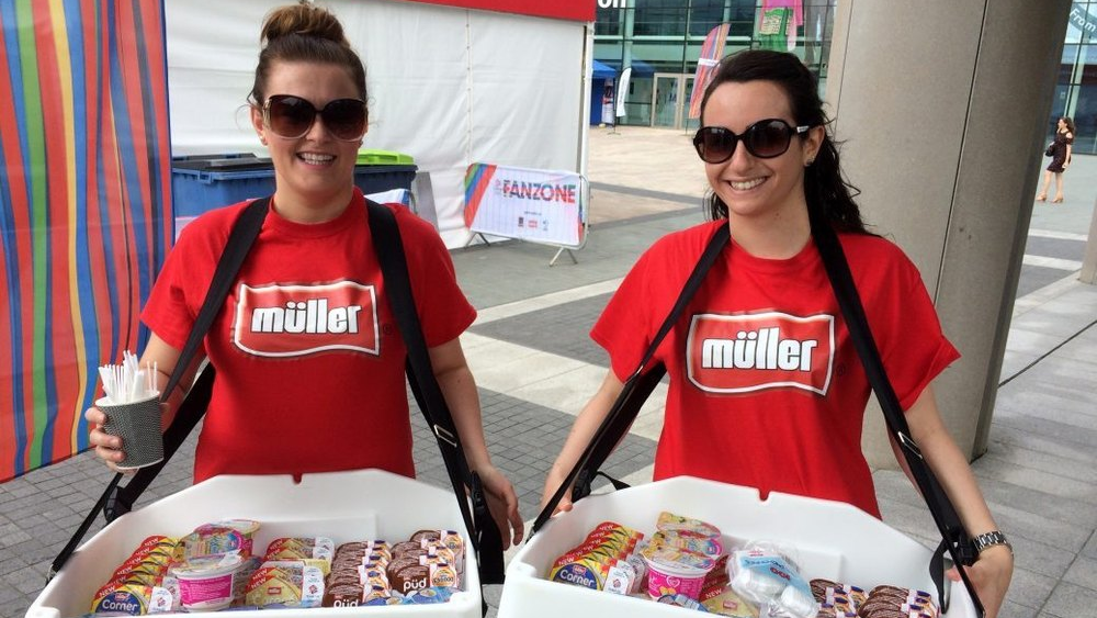 Brand promoters distributing food samples during on-ground marketing activation event