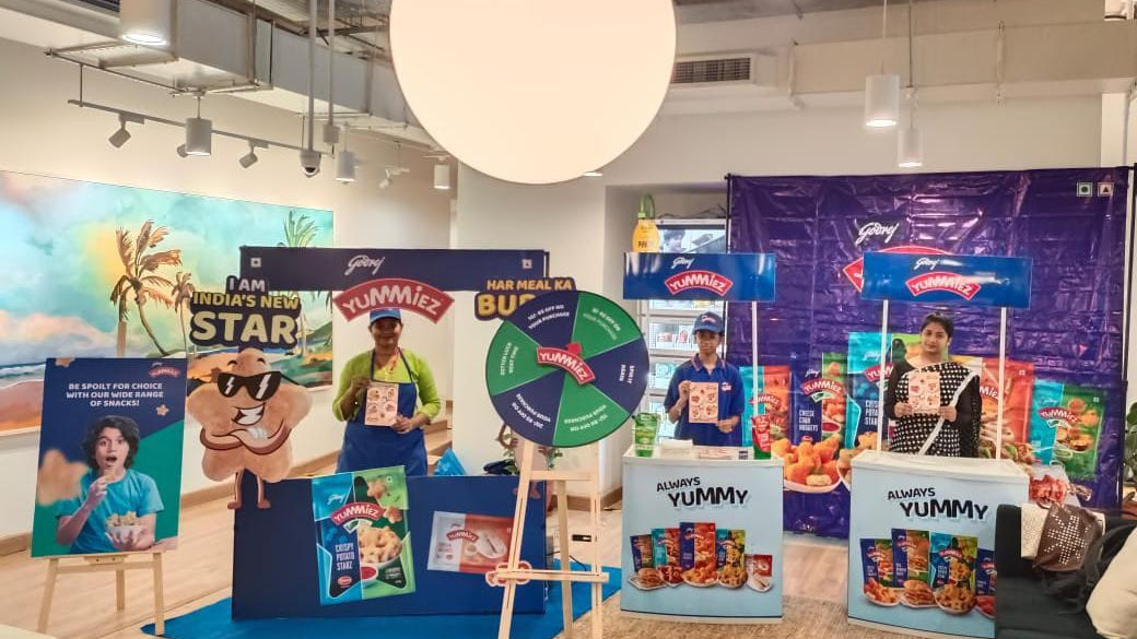 Yummiez brand activation booth with promotional setup and engagement activity indoors